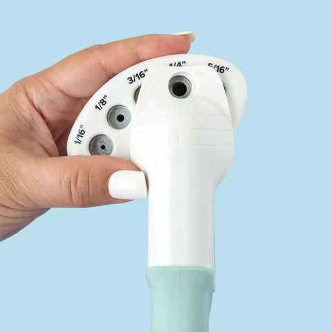 Close-up of Multi Size Hole Punch for Leather, Paper, Fabric with hand rotating to 5/16 inch hole size for crafting projects.