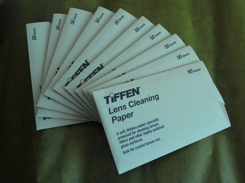 Tiffen Lens Cleaning Tissue Paper Pack Of 50 Sheets For Cameras laid out on a surface