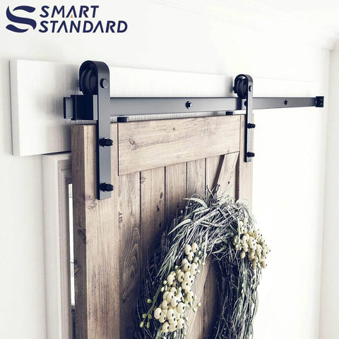 Heavy Duty Sliding Barn Door Hardware Kit For 6-Foot Track System With Smooth Quiet Glide For 36-Inch Doors Two-Piece Rail Black Finish With J-Shape Hangers No-Fuss Easy To Install Built Tough For Home Shop Or Studio Renovations installed view