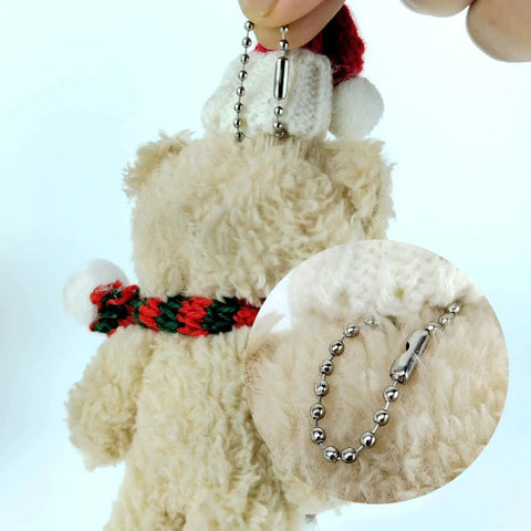 Close-up of a plush toy with 50 Pcs 4 Inch Ball Beads Chain With Connectors For DIY Hanging Decoration And Craft Projects Dog Tag Keychains In Gold Finish Made From Durable Metal With Uniform Beads And Easy Attachment For Versatile Craft Use And Long Lasting Quality