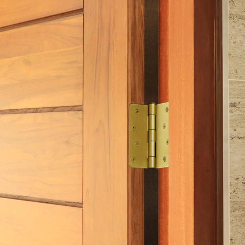 Heavy Duty Steel Door Hinges Satin Brass Finish 4 Inch Radius installed on wooden interior door
