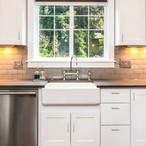 Modern kitchen with white cabinets and stainless steel appliances, featuring 30 Pack 4 Inch Brushed Nickel Cabinet Pulls Square Handles
