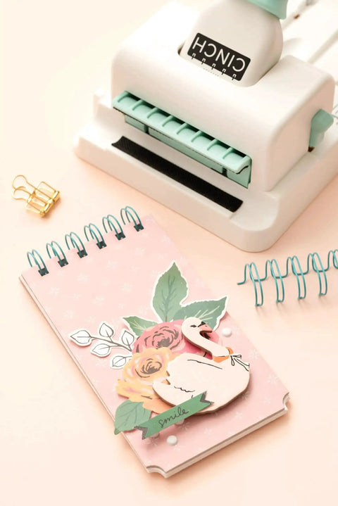 Mini Cinch Binding Tool For DIY Books And Notebooks With Wire Or Spiral Coils Pro Grade Mini Binding Machine shown with notebook