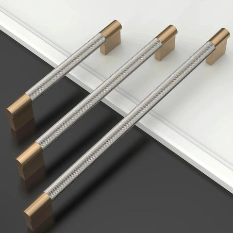 Three 10 Pack Five Inch Knurled Cabinet Pulls In Brushed Satin Nickel And Champagne Bronze for kitchen cabinets displayed on a surface