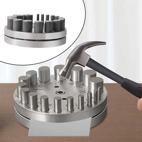 Circular Disc Cutter Set With Pendant Punch Tool And 17 Dies for Metal Forming on table, hammer added for size reference.