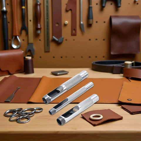 Pro Grade 3 Piece Leather Hole Punch Set With Steel Hollow Punches For Grommets 1/4 Inch, 3/8 Inch, 1/2 Inch shown on workshop table