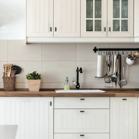 Modern kitchen with white cabinets featuring 30 Pack 2 Inch Square Cabinet Pulls Matte Black Stainless Steel Kitchen Drawer Pulls.