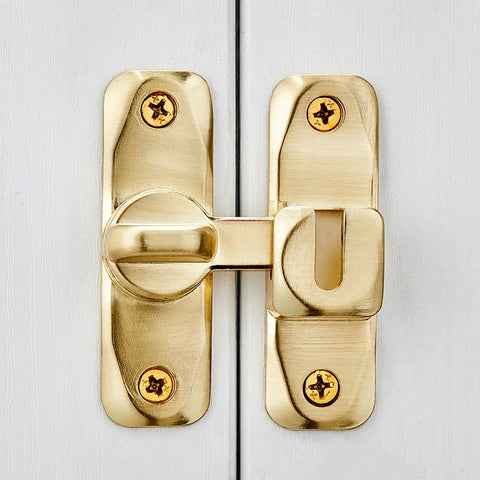 Front view of a Dual 90 180 Degree Barn Door Latch Lock in Zinc Alloy, right angle gate lock, mounted on a white door