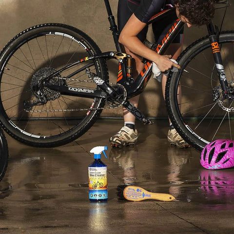 Person cleaning bike with Saver Bundle Wet Bike Chain Lube And Bike Cleaner Set Natural Eco Friendly Palm Oil Free Made In UK nearby