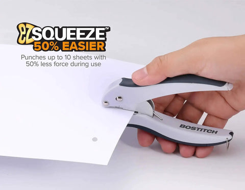 Hand using EZ Squeeze One-Hole Paper Punch, ergonomic grip, gray and blue finish, punches through 10 sheets with 50% less force