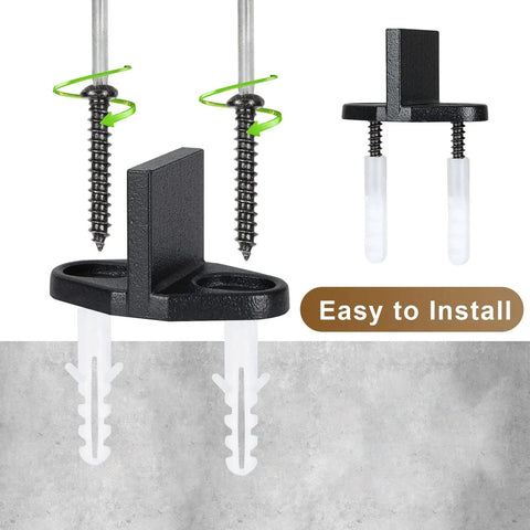 Four Pack Black T Shape Barn Door Floor Guides For Sliding Doors Bottom Track Hardware close-up with screws and guide slots