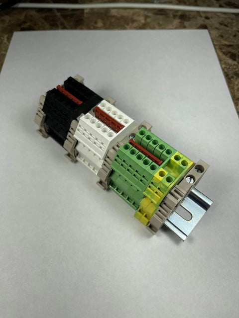 UL Listed AC DIN Rail Terminal Block Kit With Ground Blocks, Jumpers, And End Covers, 20A 600V on white background