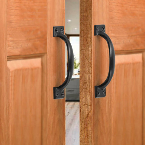 Vintage Inspired 5.5 Inch Black Curved Cabinet Door Handles Made From Solid Iron installed on wooden cabinet doors.