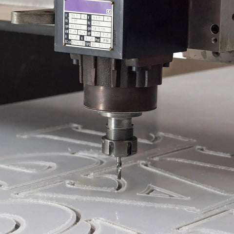 ER25 A M32 Collet Clamping Nut With Dynamic Balance Holes For CNC Lathe And Milling Tool Holders in operation on a CNC machine, black.