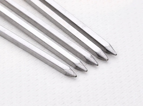 Close-up of tips of 10 Inch Stainless Steel Square BBQ Skewers Set 12 Pack With Ring Tip Handles For Easy Grilling Grill Outs Kebabs Kabobs And Veggies Keeps Food From Spinning Durable Metal Skewers Great For Grilling At Home Or On The Go.
