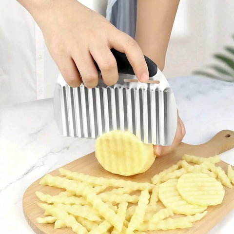Person using Stainless Steel Potato Crinkle Cutter And French Fry Cutter Large Wavy Slicer For Vegetables And Fruits Must Have Dope Durable Kitchen Chopping Tool For Potatoes Carrots Onions And More Black on potatoes