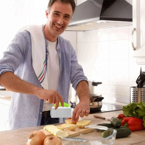 Person using Crinkle Fry Cutter For Potatoes And Veggies With A Sturdy 0.6mm Stainless Steel Blade And Non Slip 13mm Handle in kitchen