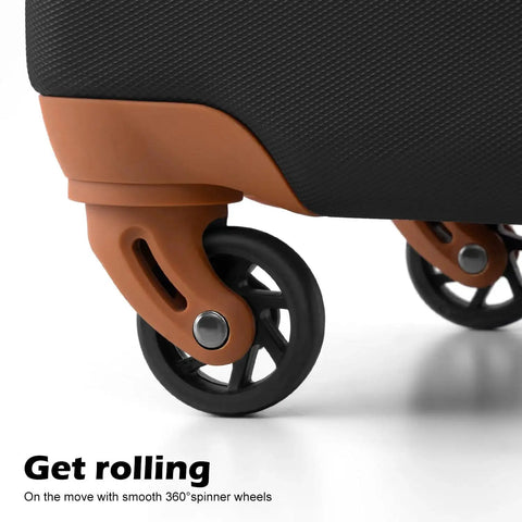 Close-up of smooth 360° easy glide spinner wheels on black lightweight ABS luggage part of the 3 piece hardside set with TSA lock.