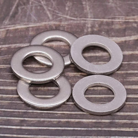 Group of 1/4-inch stainless steel flat washers, 0.28 in ID, 0.63 in OD, bright finish, pack of 50
