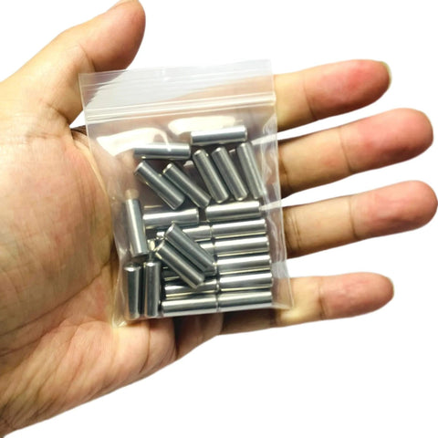Hand holding Beefy 25 Pack 6mm x 20mm Dowel Pins Stainless Steel 304 For Woodworking And Furniture Shelves And Beds Built Tough