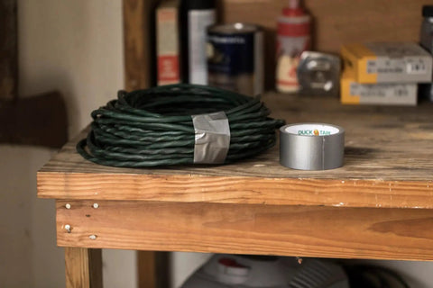 Silver roll of Duct Tape 1.88 Inch By 60 Yard Silver For Quick Repairs And Sealing on wooden workbench