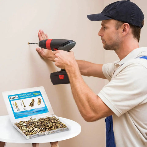 Man using 180 Piece Self Drilling Drywall Anchors Kit With 90 Metal Winged Zinc Plated Anchors And 90 Screws for wall mounting.