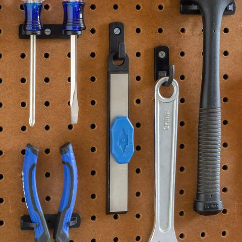 Carbide Cutter Honing System with diamond sharpening tool and magnetic grip for carbide inserts hanging on pegboard