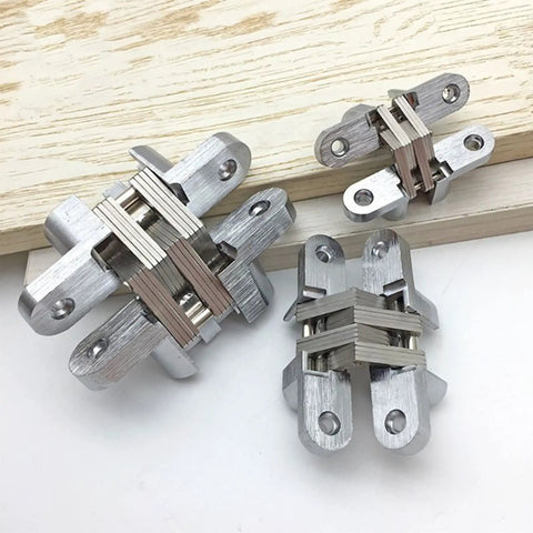 2Pcs Stainless Steel Hidden Hinges For 180 Degree Concealed Folding Doors, Invisible Cross Hinge on wooden surface