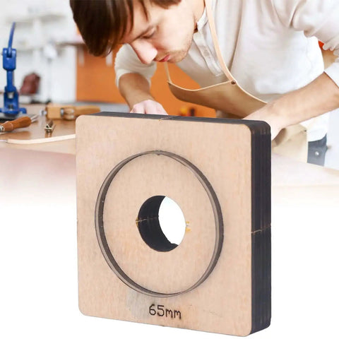 65mm Circular Leather Hole Punch Die For DIY Leatherworking Projects And Card Holders Purses Belts And More With Clean Shiny Edges And Pro Grade Durable Alloy Steel Construction Your Go To Tool For Precise Holes shown with craftsman in background
