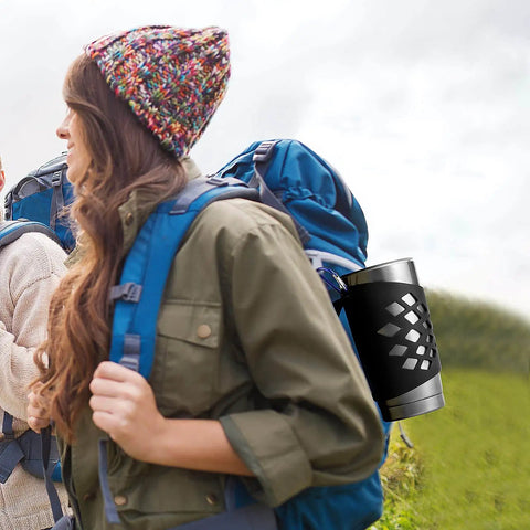 Person hiking with Durable Silicone Tumbler Sleeve With Handle For 20 Oz Cups No Slip Grip Insulated Protective Cover Black