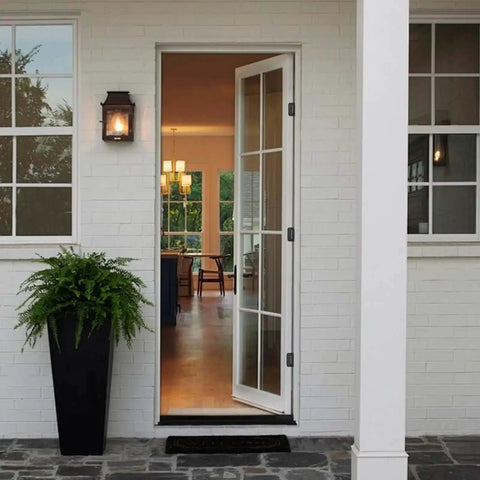 Front view of installed Black 4 Inch Self Closing Door Hinges on a white door, 5/8 inch radius corners, residential use