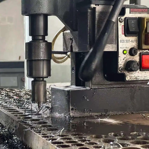 Magnetic drill press using the Six Piece Annular Cutter Set With One Inch Cutting Depth For Magnetic Drill Press No Frills Value Packed Diameters