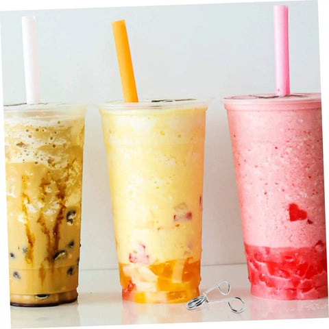 Three sealed bubble tea cups with colorful straws next to a 10 Piece Stainless Steel Spring Clips For Cup Sealing Machines Universal Replacement Accessories For Bubble Tea And Coffee Sealing No Fuss Setup Easy Installation And Secure Cup Mouth For Airtight Seal.