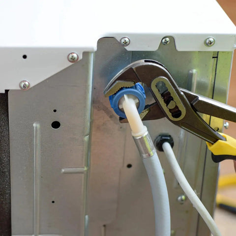 Set Of Four Rubber Grommets For Firewall Cable Protection, Inner Diameter 2 Inches, installed in metal panel with pliers