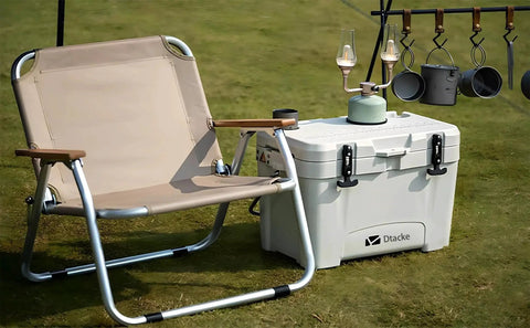 Cooler with Flexible Rubber T Handle Draw Latch Replacement For Cooler 160mm on grass, next to a chair and hanging tools