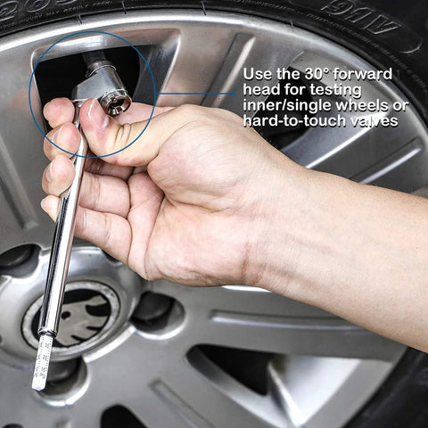CZC AUTO pencil tire pressure gauge with silver stainless steel stem and dual head chuck on a car tire.