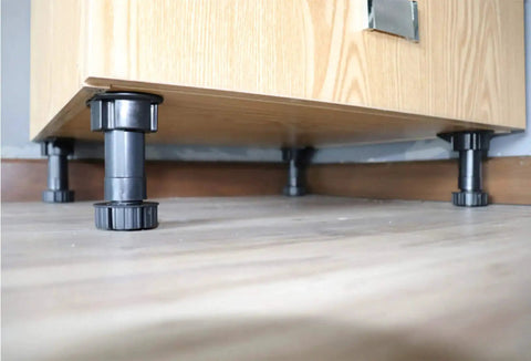 Close-up of 12 Pack Black Cabinet Leveler Legs Adjustable Furniture Feet Elevate Cabinets From Three And Seven Eighths Inches To Five And One Eighth Inches