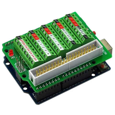 Arduino Screw Terminal Block Breakout Module For Uno R3 Soldered And Ready To Use 3 5mm Pitch Fits 26 AWG To 16 AWG Wires M2 Screws 40 Pin IDC Header Perfect For Quick Prototyping And Clean Wiring On Your Projects with green circuit board and labeled terminals