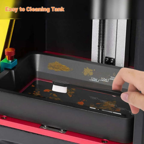 Cleaning the vat tank of a 3D printer using the Must-Have 7-Piece UV Resin 3D Printer Cleaning Kit With Silicone Spatulas, Scrapers, And Brushes.
