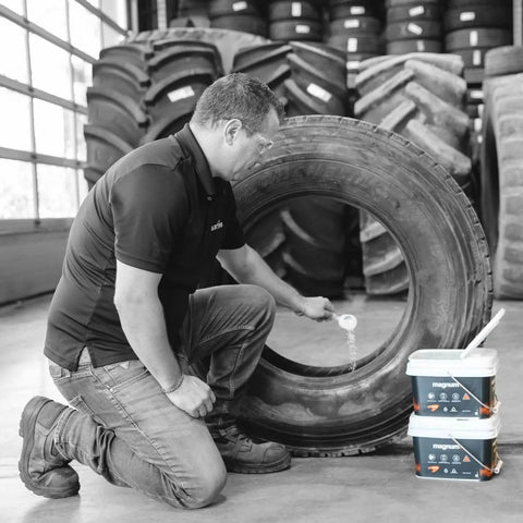 Person installing Tempered Glass Tire Balancing Beads Bulk Tub 17.6 Lb 8 Kg Pro Install No Wheel Weights Needed TPMS Compatible Durable Beads