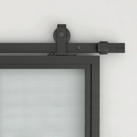 Close-up of 30 Inch By 84 Inch Frosted Glass Barn Door With Black Steel Frame And Three Quarter Lite Panels Ships Fully Preassembled