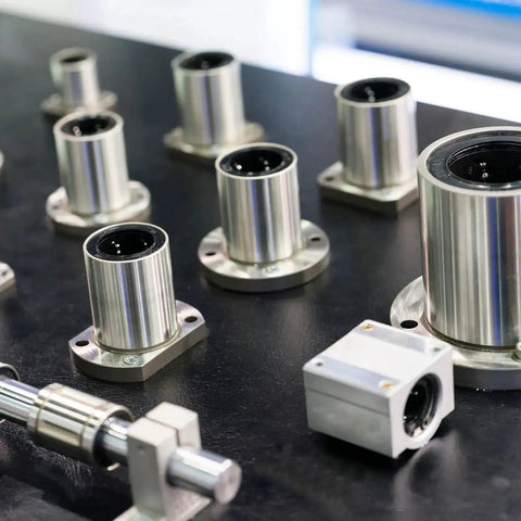 LM12UU Linear Ball Bearings 12mm Bore 21mm Outer Diameter 30mm Length 4 Pack on a metal surface