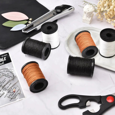 Extra Strong Upholstery Repair Sewing Thread Kit with heavy duty hand needles and three rolls nylon thread, sewing tools visible.