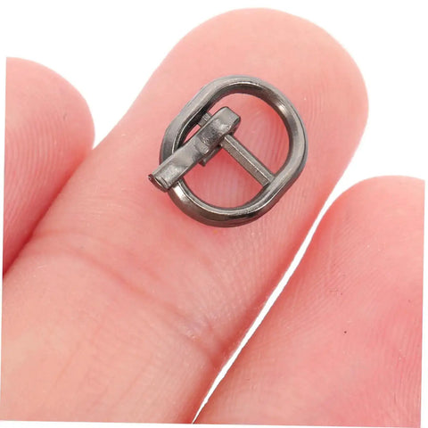 Close-up of alloy single prong belt fastener from Handy Mini Buckle Sewing Kit 150 Piece Set for Doll Clothes and DIY Craft Projects.