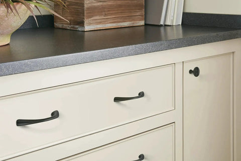 Vaile Matte Black Cabinet Pull 3-3/4 Inch Center to Center on cream kitchen drawer, contemporary style, smooth bold finish.