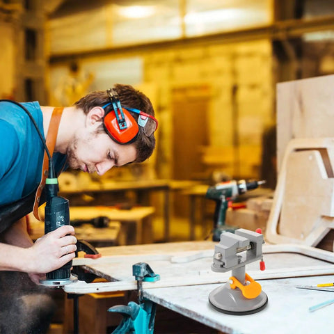Multi Functional Rotating Bench Vise With Swivel Tabletop Clamp in use for woodworking in a workshop setting.