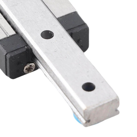 Close-up of 7mm Miniature Linear Rail Guide Slide Block LML7B with Lubrication System showing metal structure and mounting holes