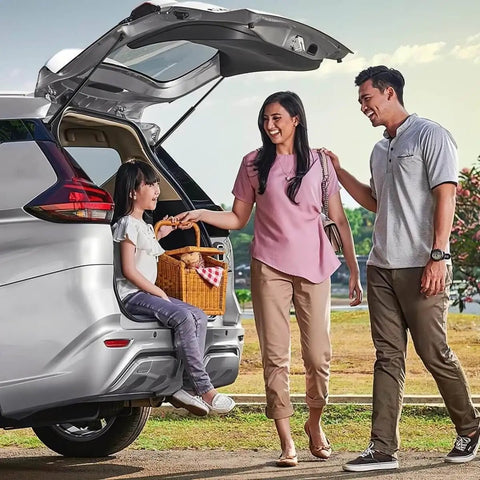 Family enjoying a picnic with SUV tailgate open showcasing liftgate support shocks for Kia Soul 2014 to 2019.