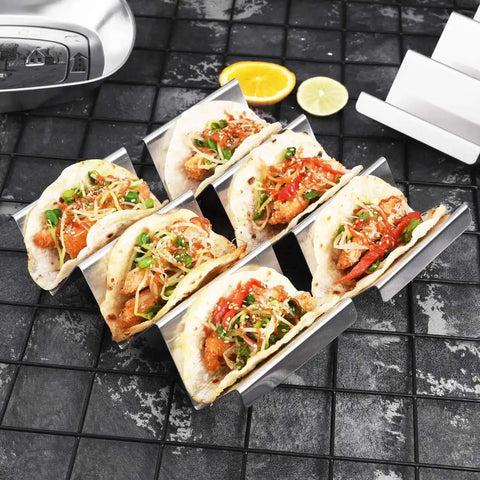 Stainless Steel Taco Holders 4 Pack, Durable Taco Stand Rack Tray Style, Oven Safe for Baking, with street tacos and toppings.
