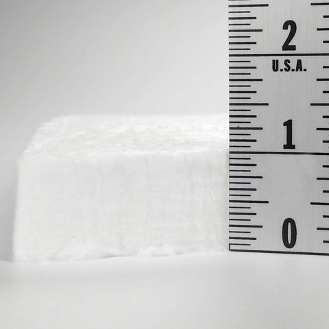 Ceramic fiber insulation block, 1 in thick, white, shown beside a ruler for scale.